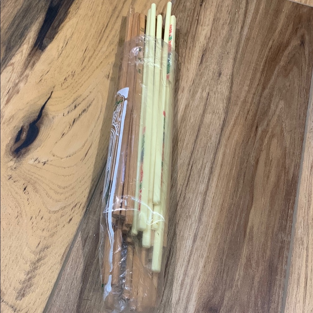 Opened bag of new bamboo chopsticks and some plastic chopsticks from Taiwan